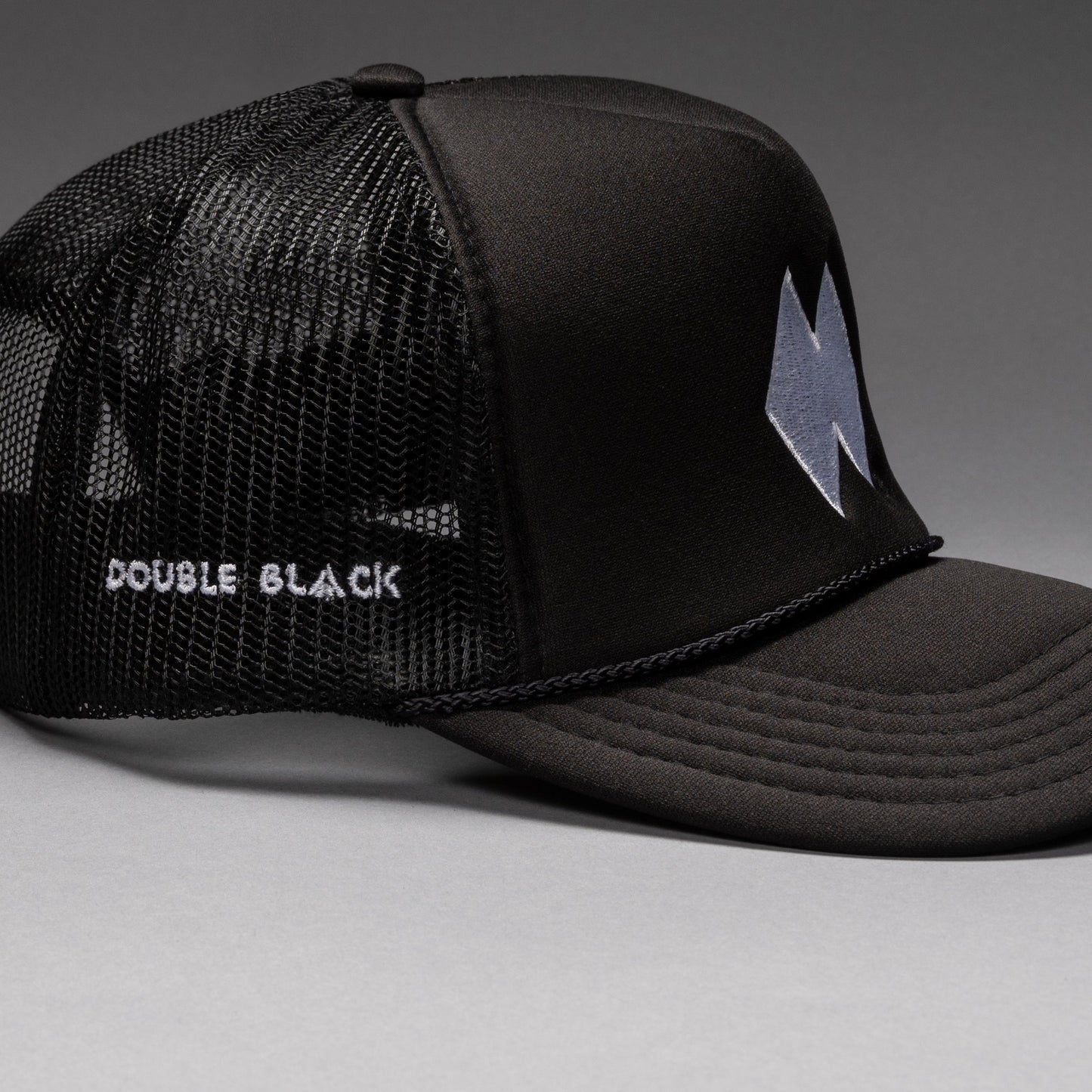 Black and white DBL Trucker
