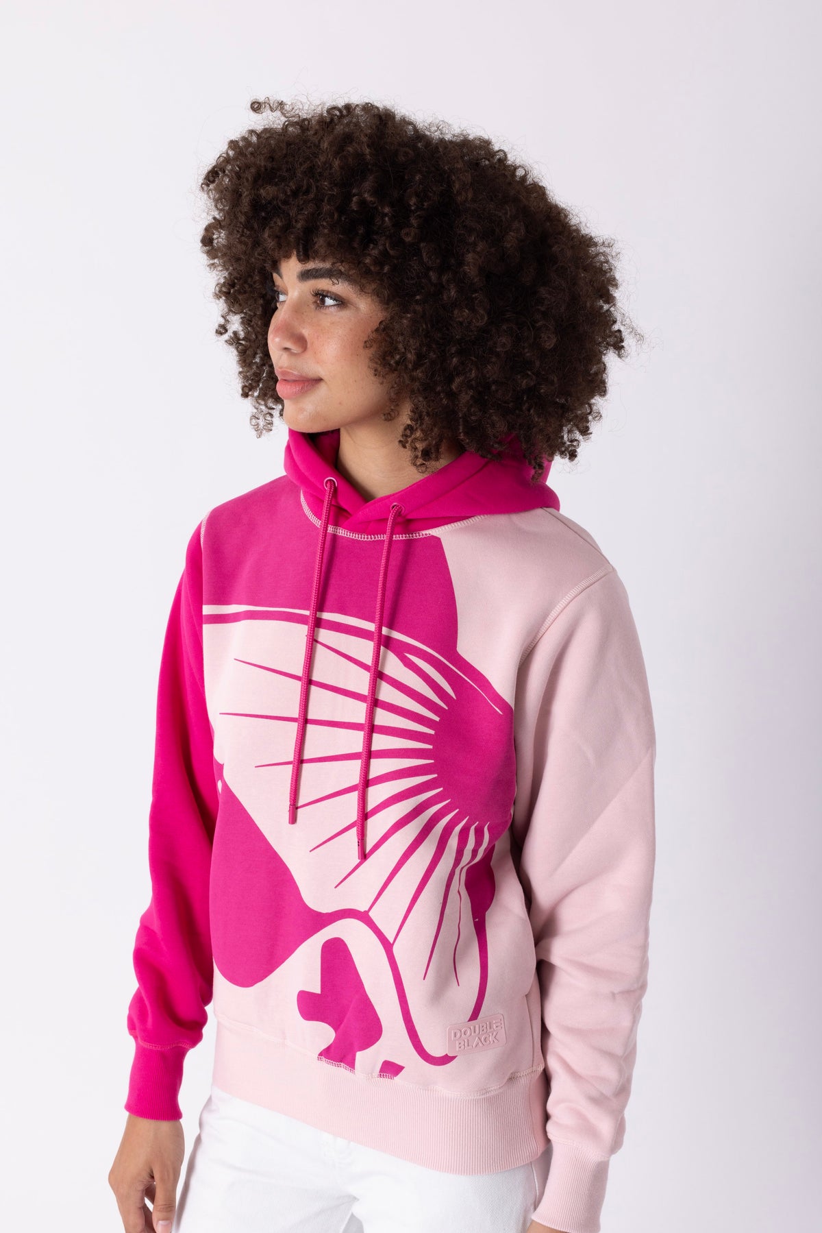 Model wearing Double Black On The Mountain Hoodie in pink