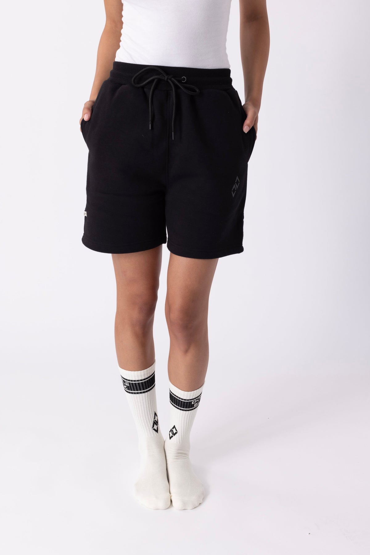 Model wearing Double Black Experts Only Sweatshorts in black