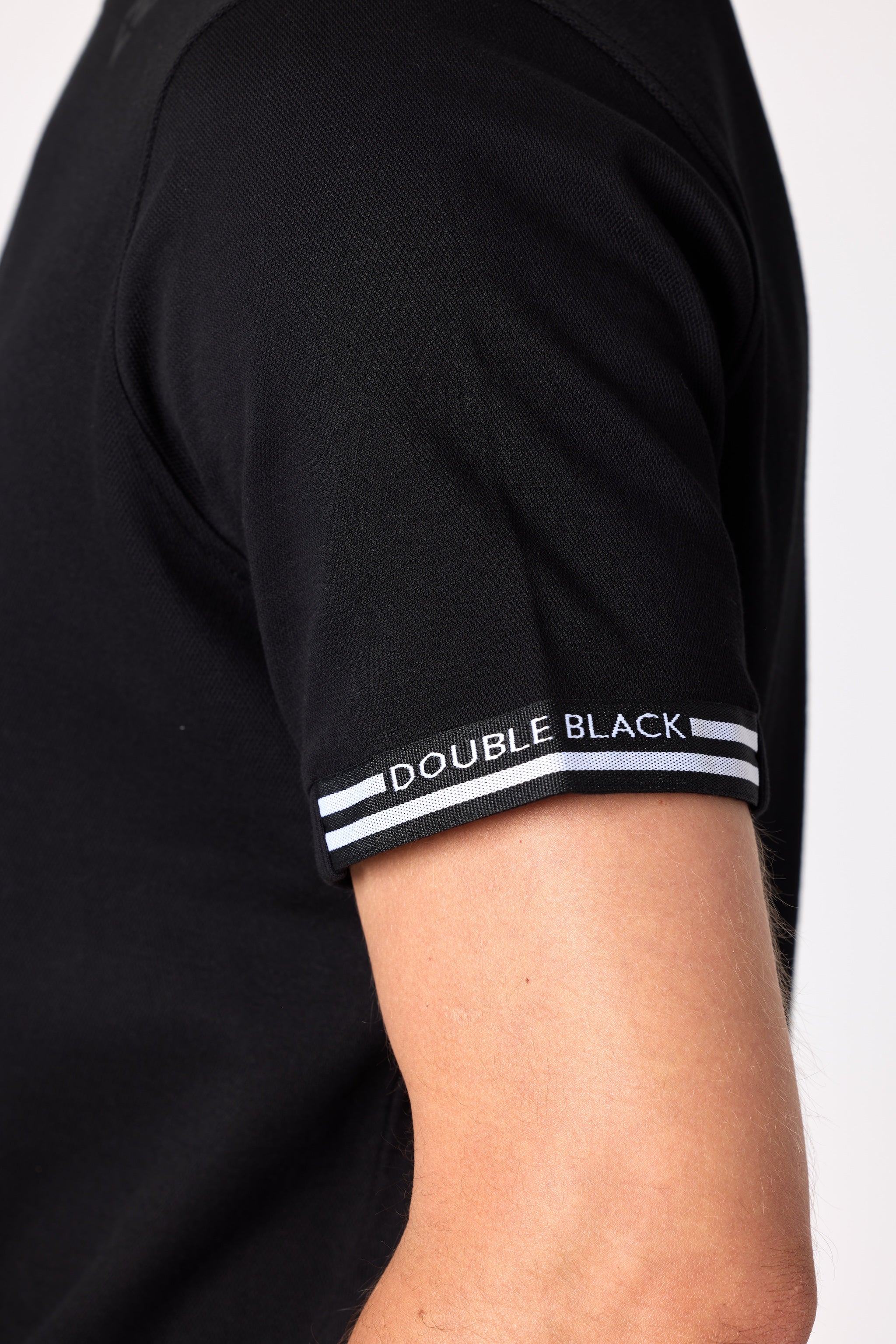 Double Black Après ‘83 Ribbed Tee in black sleeve detail