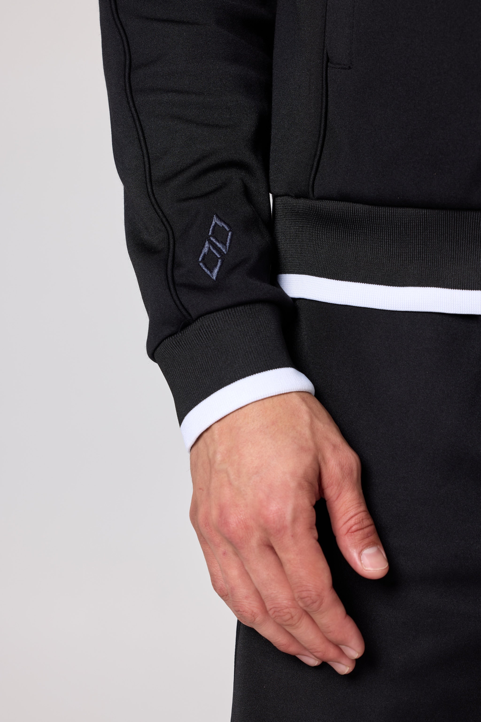 Double Black Après ‘83 Track Jacket in black sleeve detail