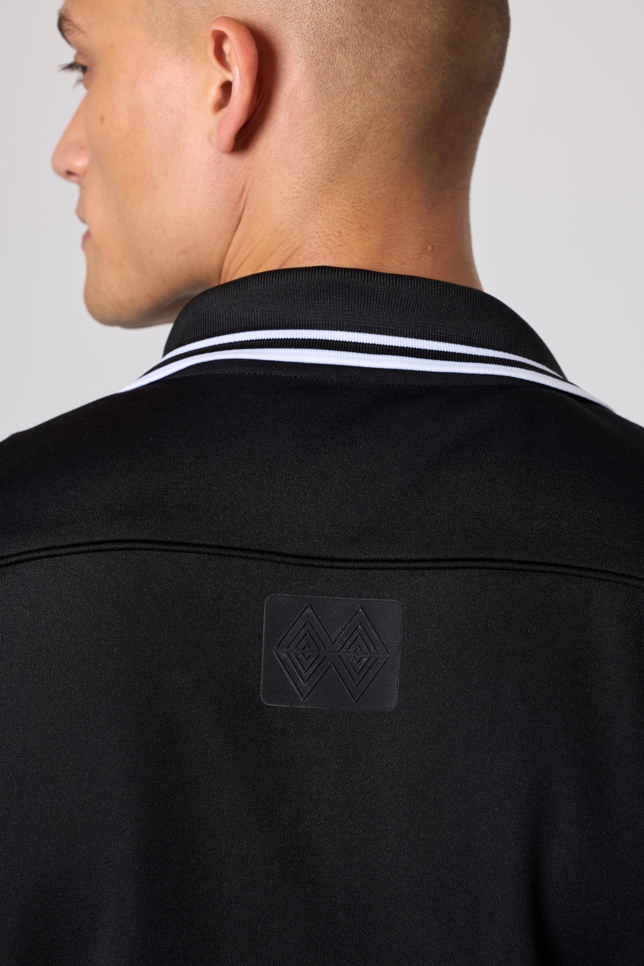 Double Black Après ‘83 Track Jacket in black back view