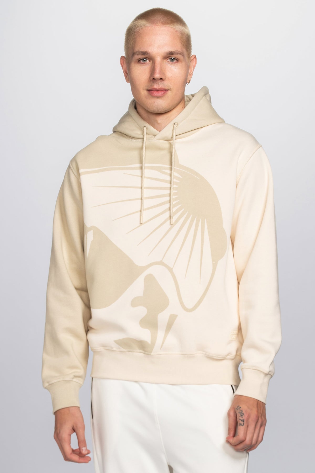 Model wearing Double Black On The Mountain Hoodie in cream