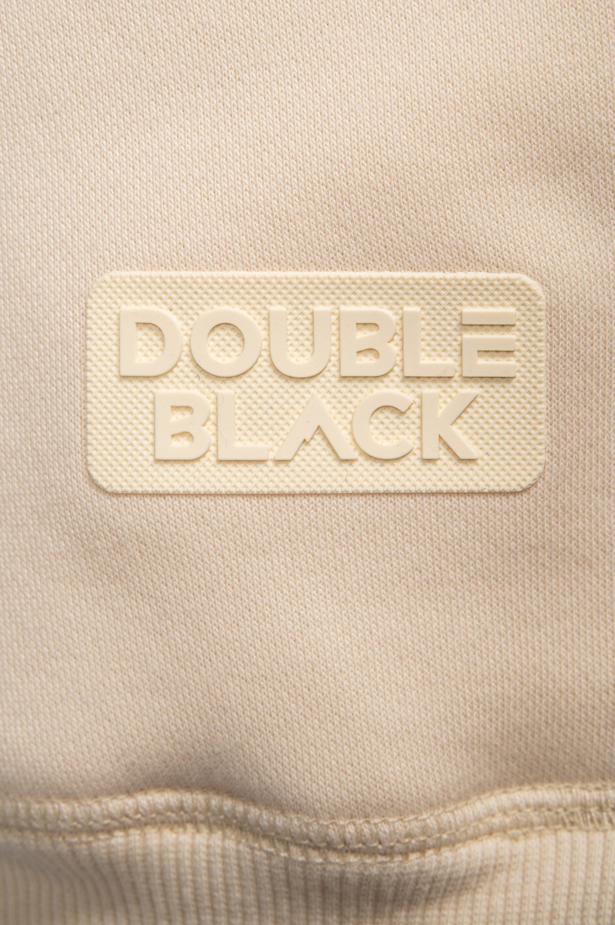 Model wearing Double Black On The Mountain Hoodie in cream