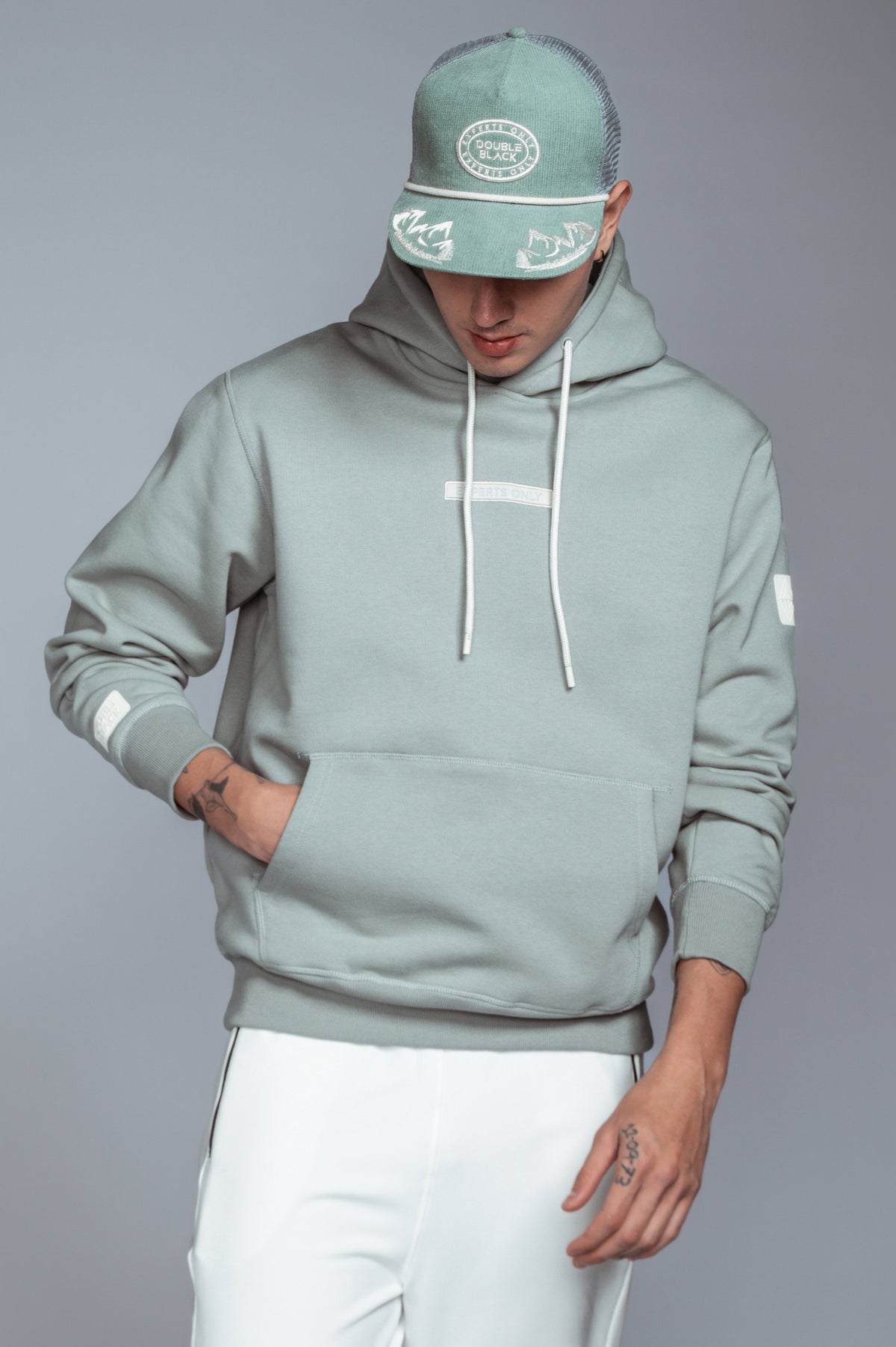 Experts Only Hoodie in Sage and Corduroy Trucker Hat in Sage– full front view