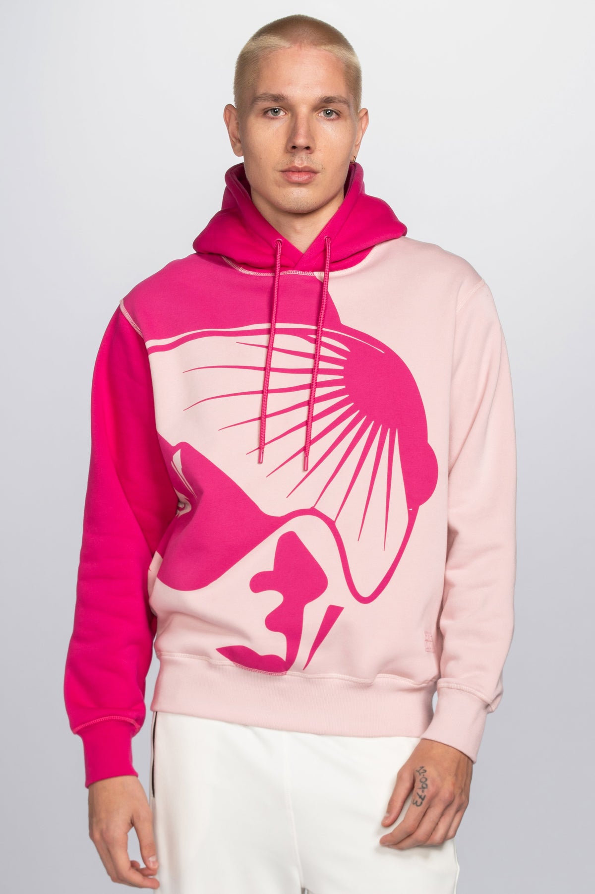Model wearing Double Black On The Mountain Hoodie in pink