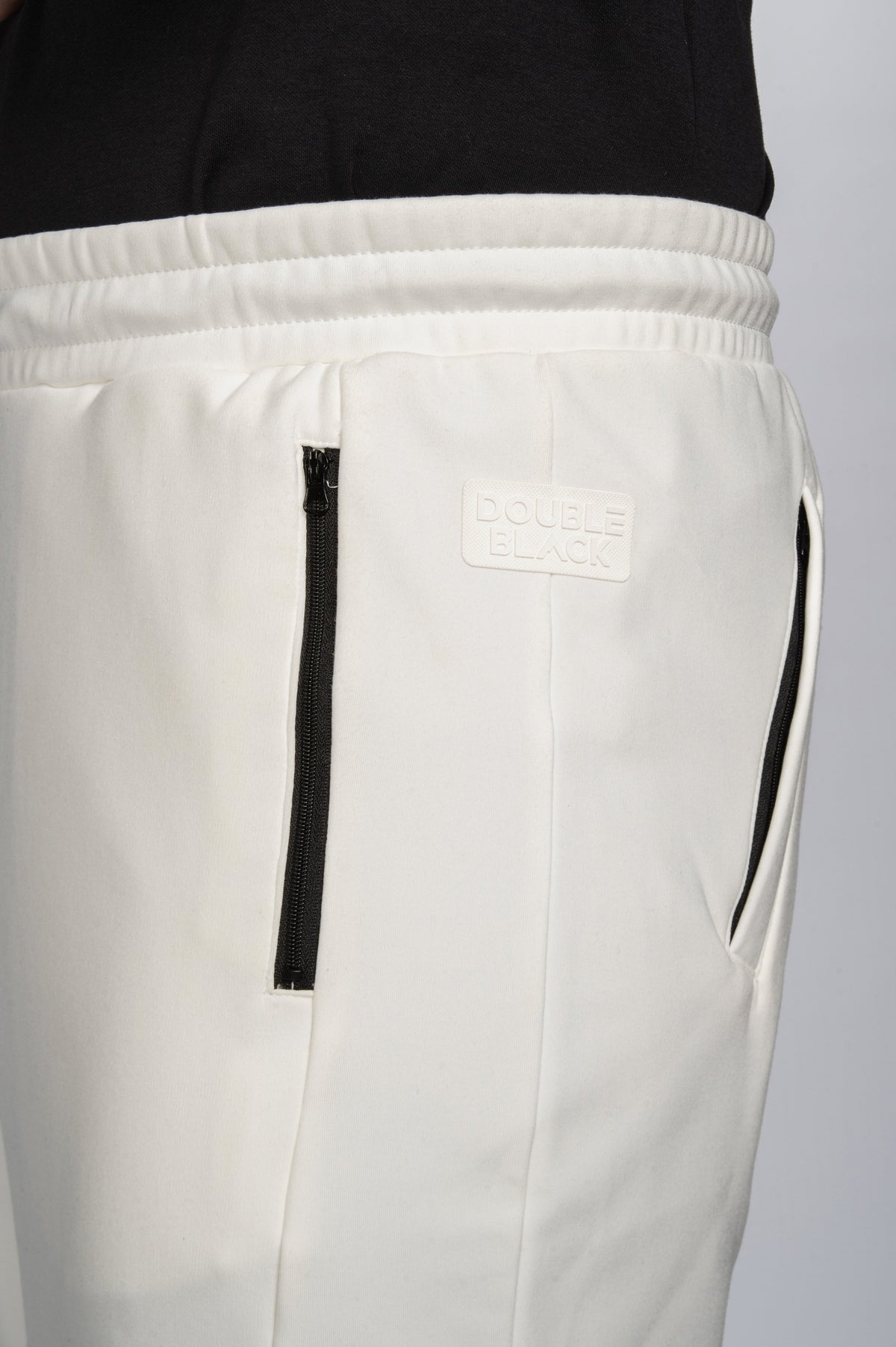 Double Black Tech Sweatpants in cream zipper pocket