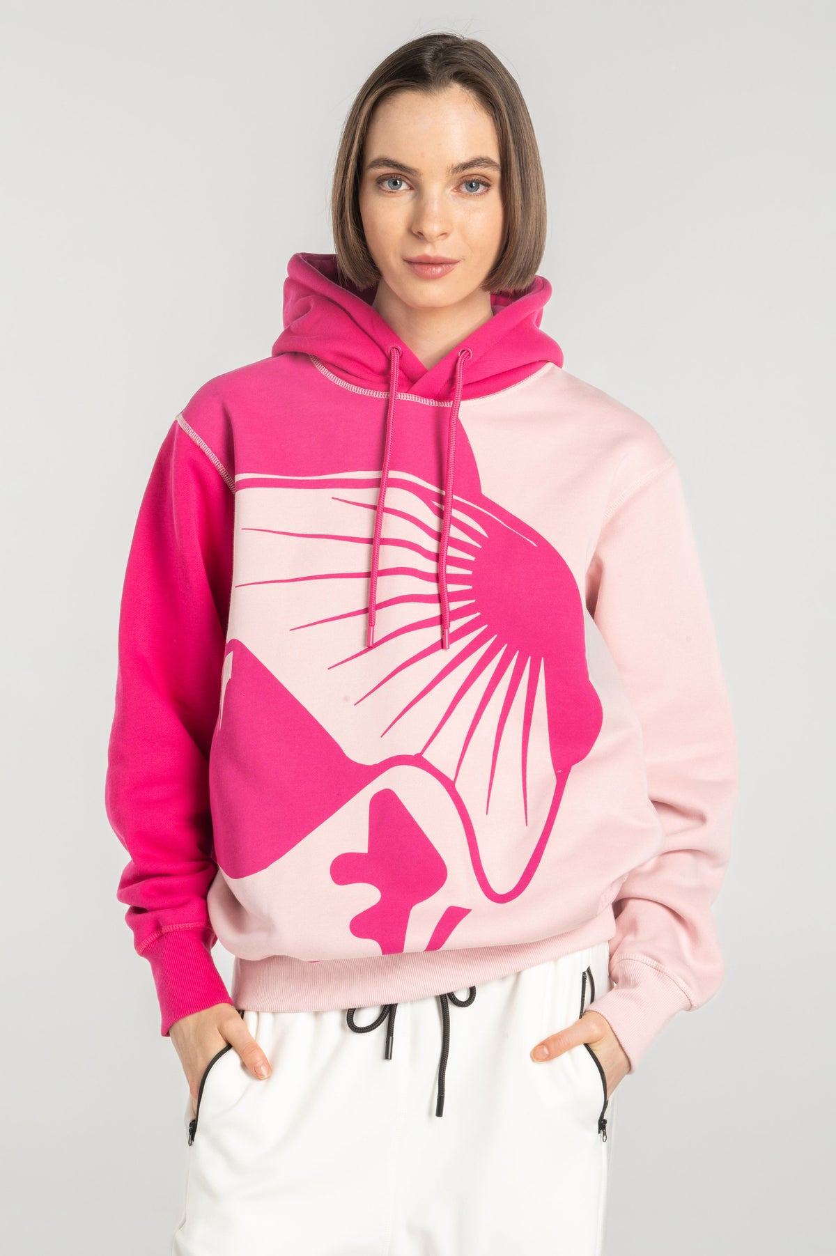 Model wearing Double Black On The Mountain Hoodie in pink