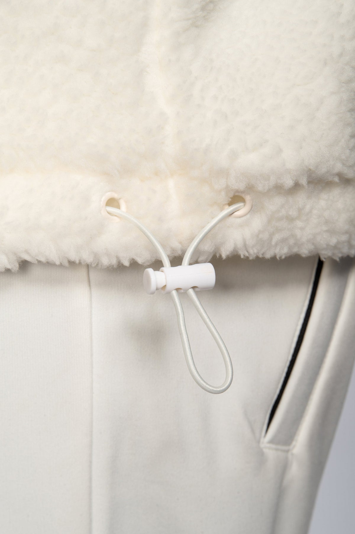 close up of Double Black sherpa hoodie in white draw string